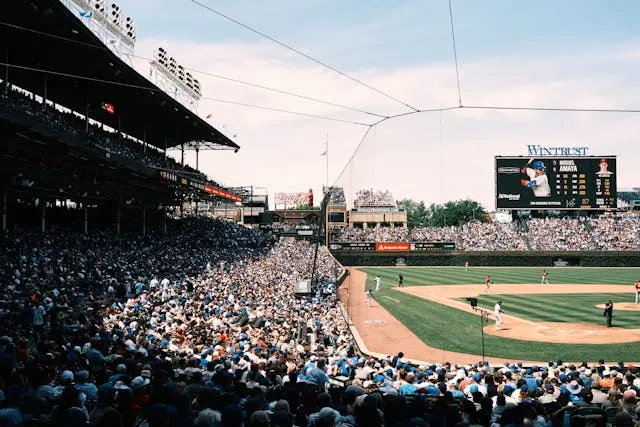 Full stadium of enthusiastic baseball fans during a live MLB game, illustrating the deep fan loyalty and emotional connection in American sports.